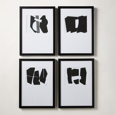 four black and white prints in a grid gallery wall layout